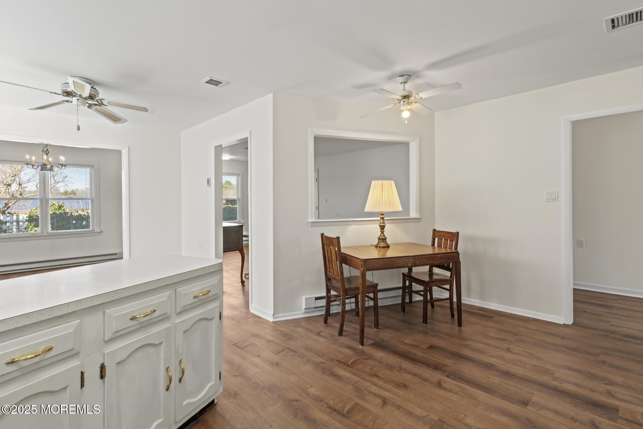 43 Patmore Road Brick, NJ 08724 - Photo 10 of 36 a view of a a dining room with furniture window and wooden floor