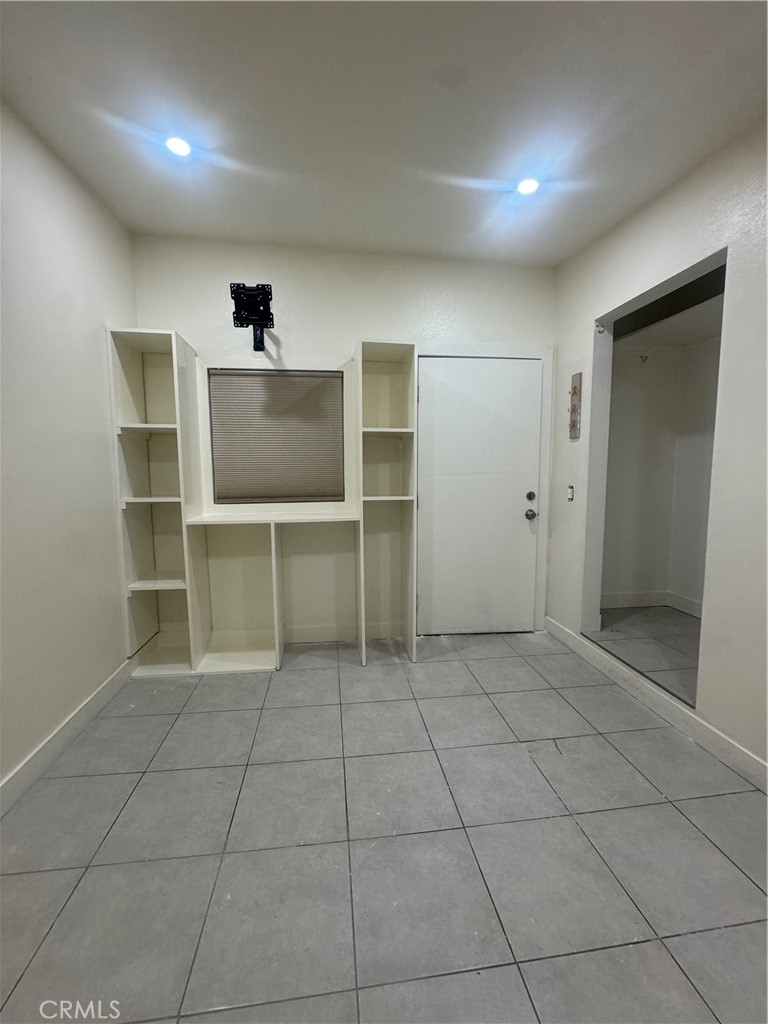 a view of an empty room with a fireplace