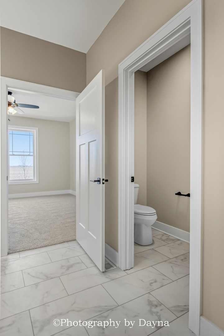 392 White Hawk Way Manteno, IL 60950 - Photo 16 of 25 a bathroom with a toilet and a shower