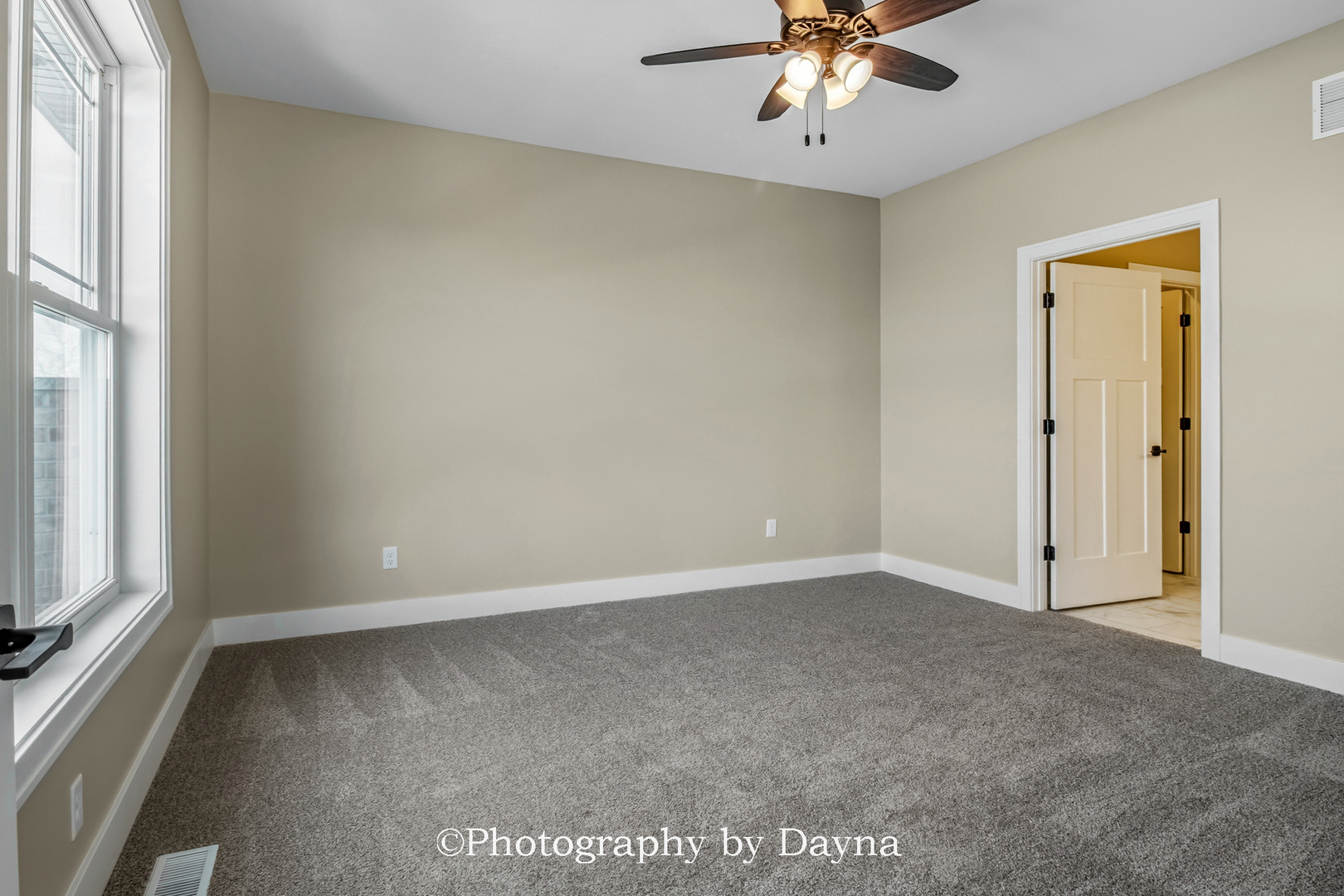 392 White Hawk Way Manteno, IL 60950 - Photo 18 of 25 an empty room with a window and a ceiling fan