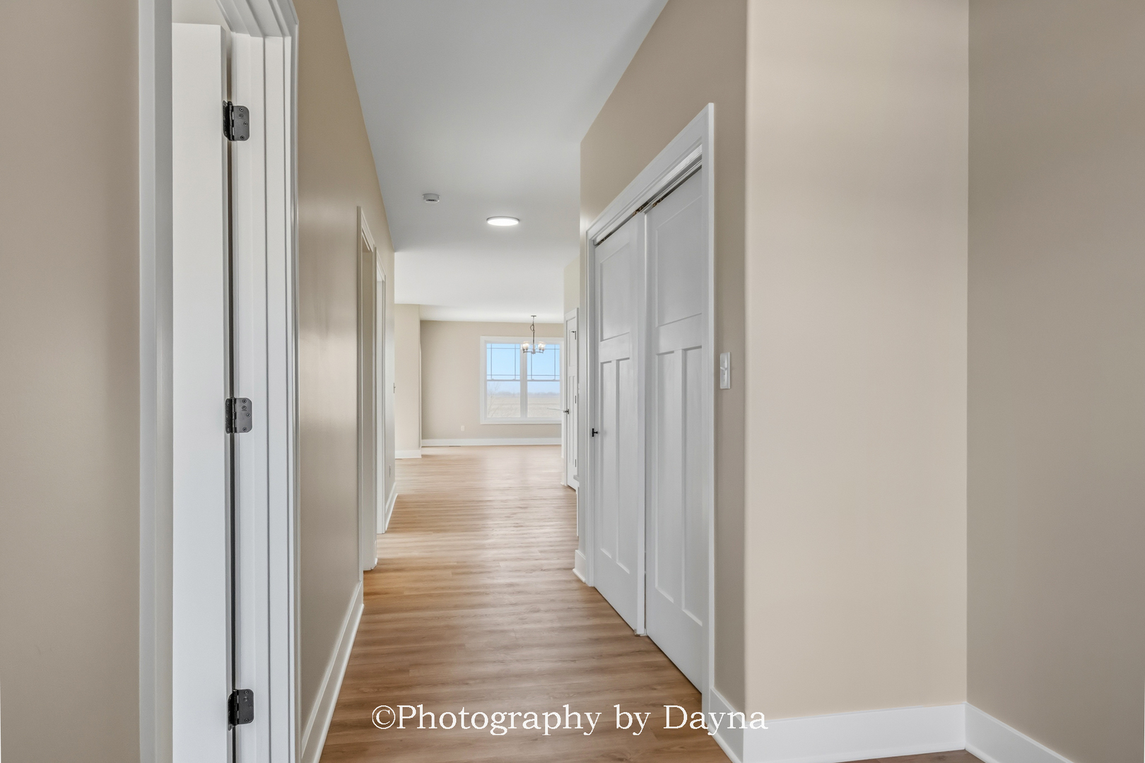 392 White Hawk Way Manteno, IL 60950 - Photo 5 of 25 a view of a hallway with a wooden floor