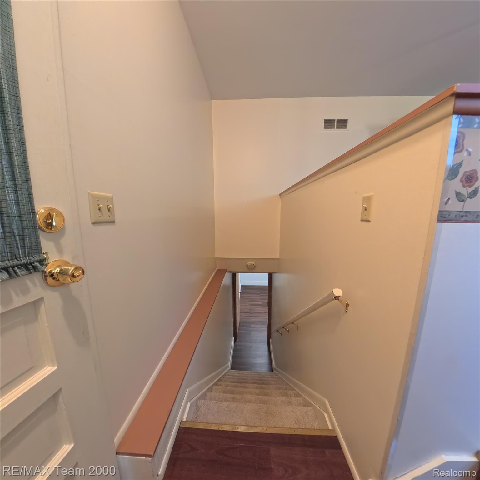 2104 Whittier Road Ypsilanti, MI 48197 - Photo 30 of 45 Staircase with wood finished floors and baseboards