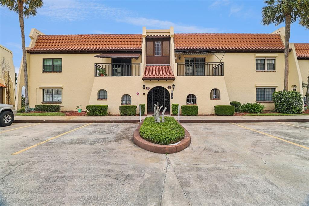 115 Indian River Drive, Unit 207 Cocoa, FL 32922 - Photo 1 of 20 a front view of a house with garden