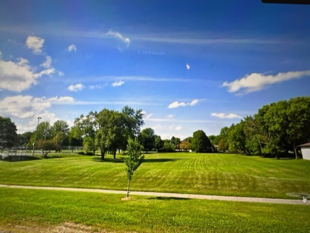 a view of a golf course with a lake