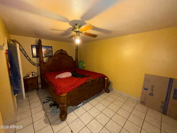 a bedroom with a bed and cabinets