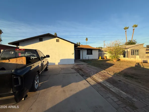 a view of a patio with a table and chairs