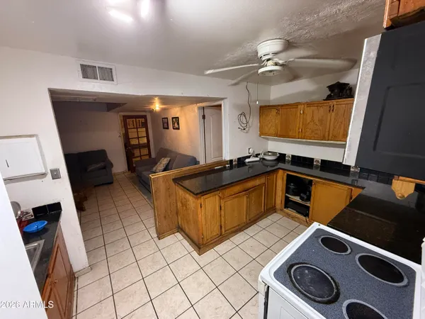 a kitchen with a stove and a sink