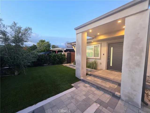 a view of a porch with a yard