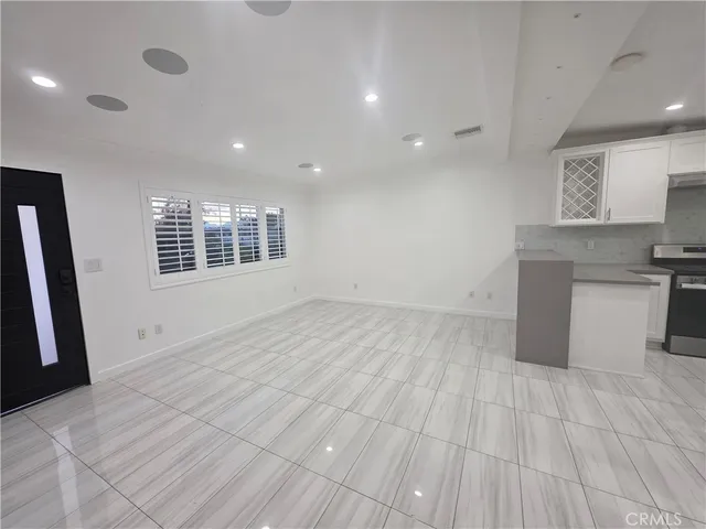 a view of a kitchen with a sink cabinets and a window