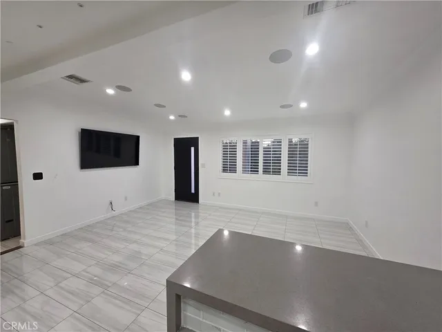 a view of an empty room with windows