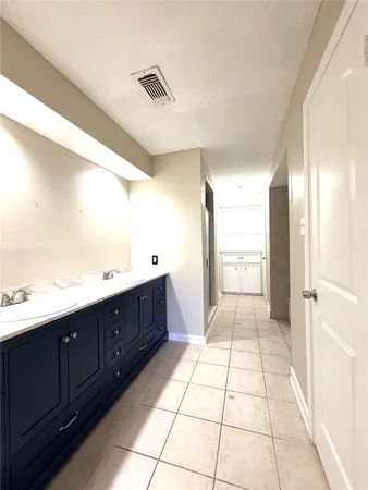 a bathroom with a vanity mirror and a sink