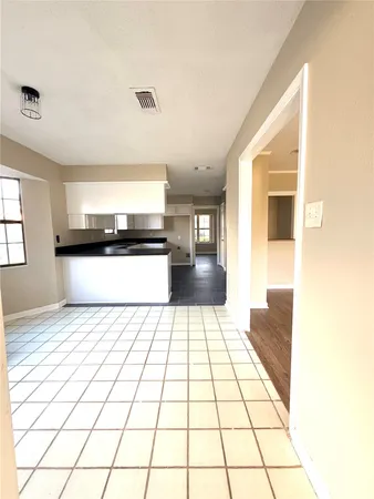 a view of a living room with a large window