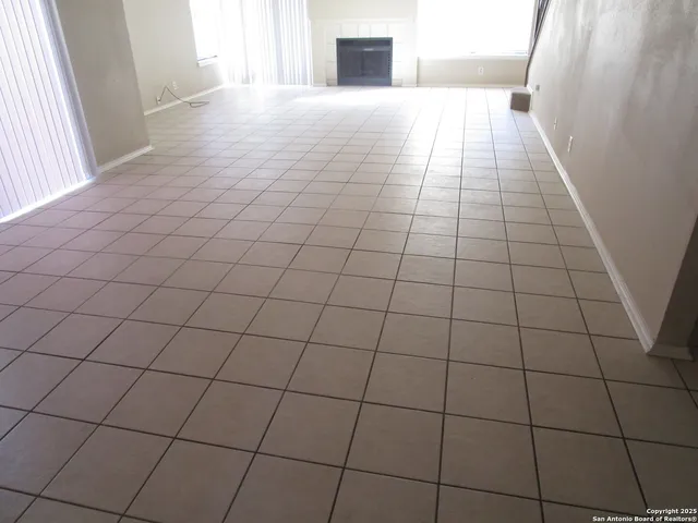 a view of empty room with windows