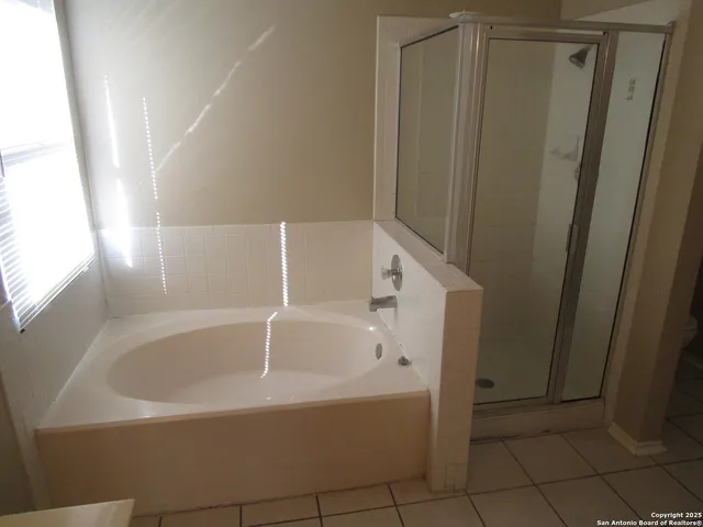 a white bath tub sitting in a bathroom