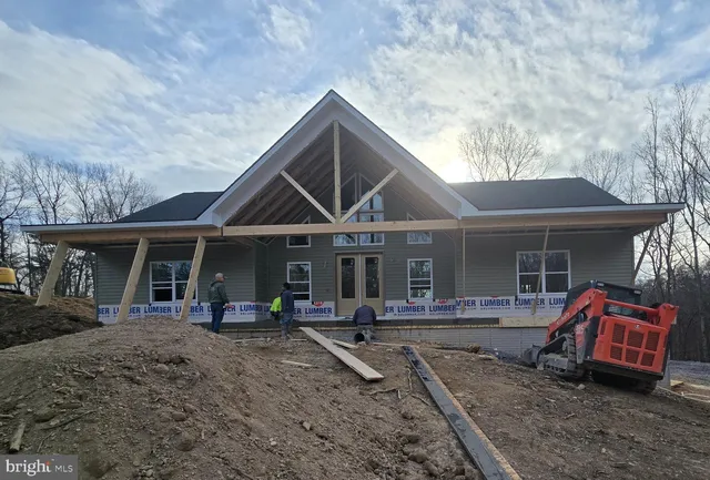a front view of house with outdoor seating