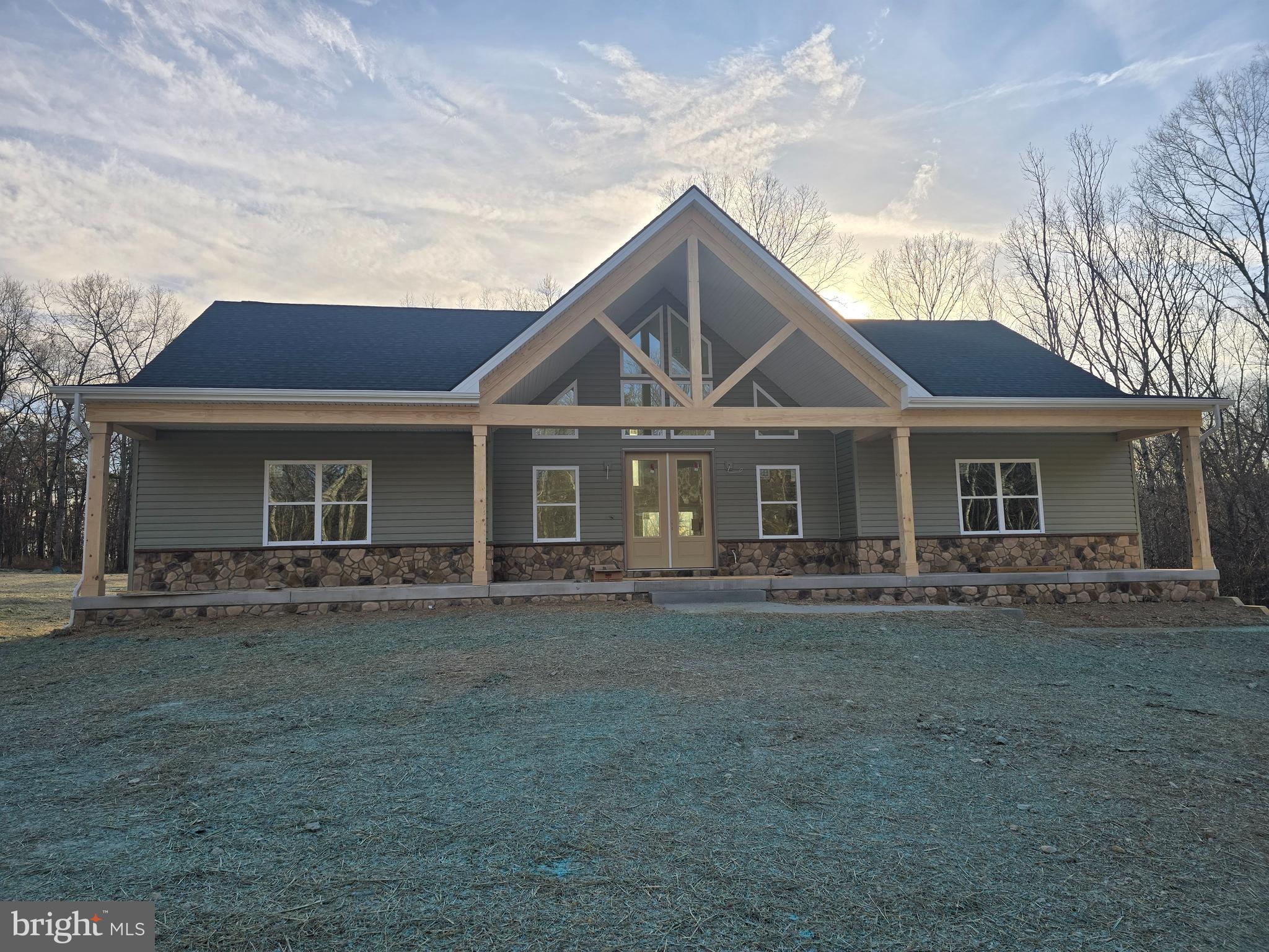 457 Myla Lane Hedgesville, WV 25427 - Photo 1 of 4 a front view of a house with a garden