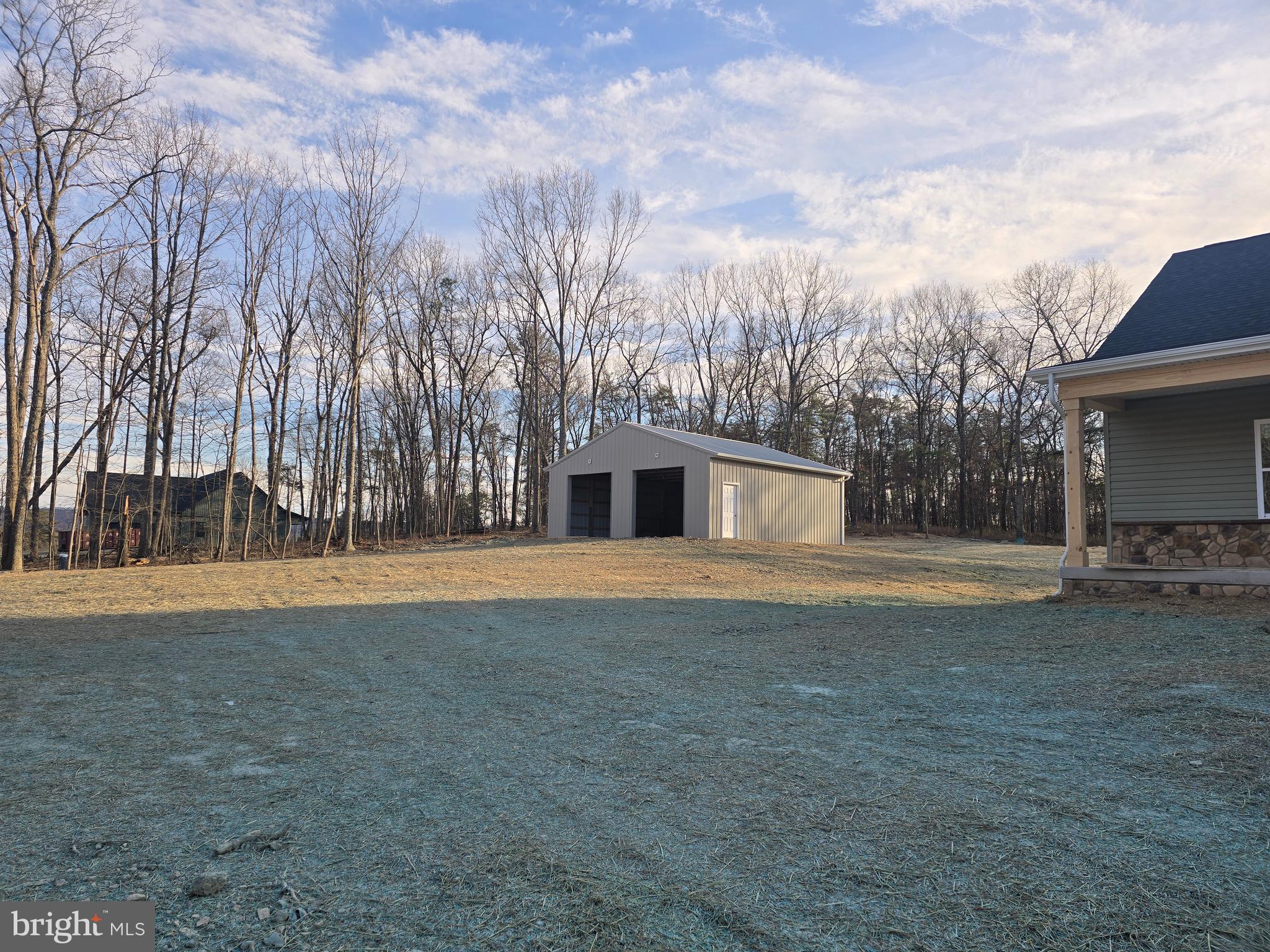 457 Myla Lane Hedgesville, WV 25427 - Photo 2 of 4 a view of backyard of house with trees