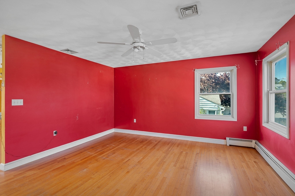 7 Marie Street Methuen, MA 01844 - Photo 24 of 39 a view of empty room with wooden floor and fan