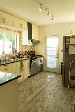 a kitchen with a sink and cabinets