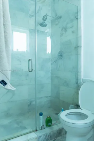 a bathroom with a bathtub sink and mirror