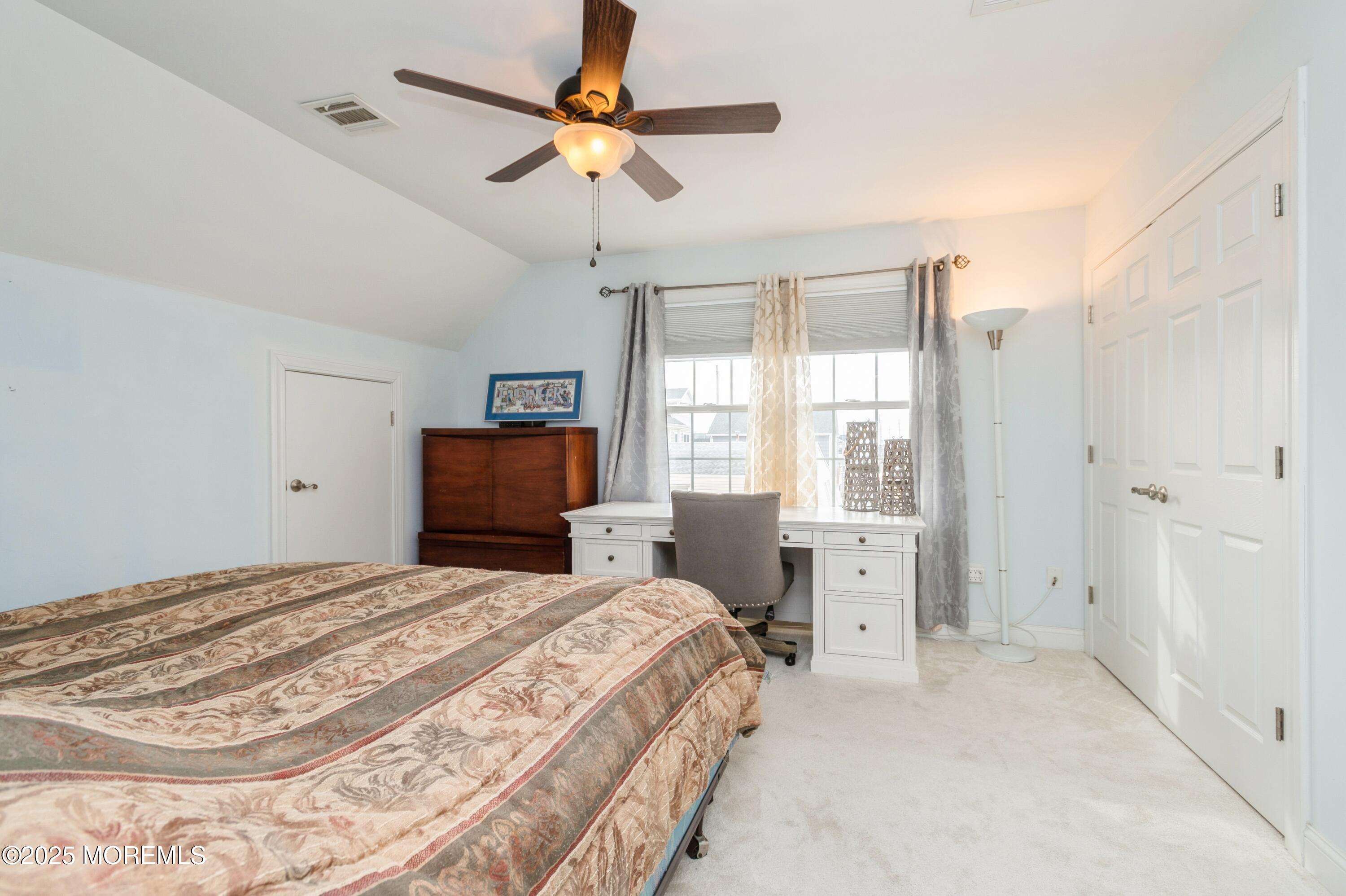 143 North Bayside Road Lavallette, NJ 08735 - Photo 12 of 23 a bedroom with a large bed and a window
