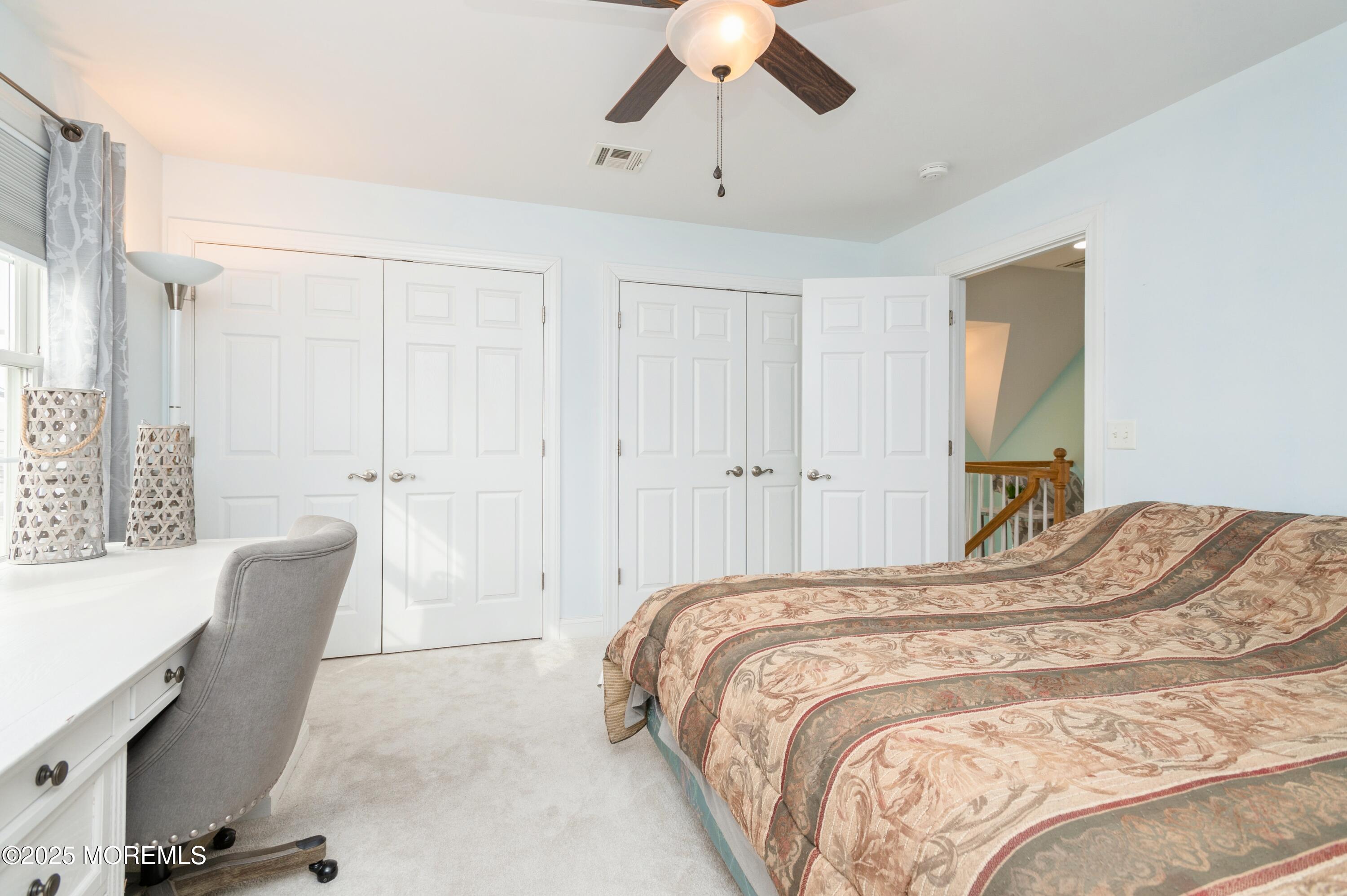 143 North Bayside Road Lavallette, NJ 08735 - Photo 13 of 23 a bedroom with a bed and a chair