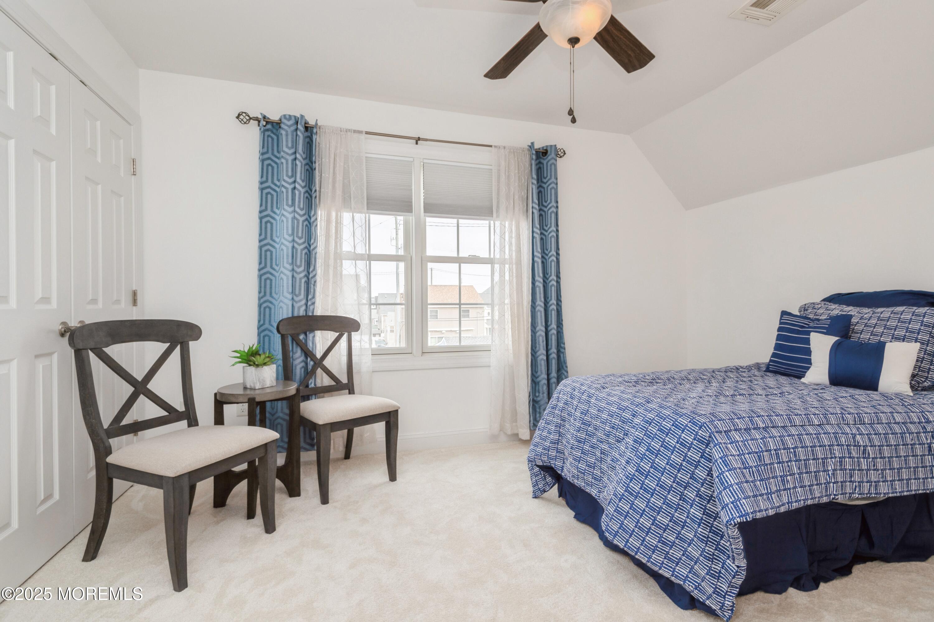 143 North Bayside Road Lavallette, NJ 08735 - Photo 14 of 23 a bedroom with a bed and a table
