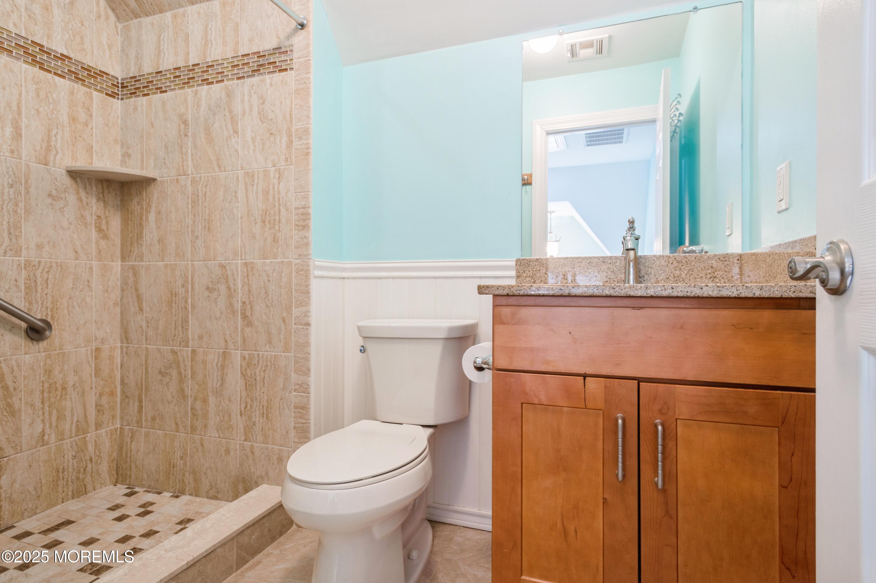 143 North Bayside Road Lavallette, NJ 08735 - Photo 15 of 23 a bathroom with a sink a toilet and shower