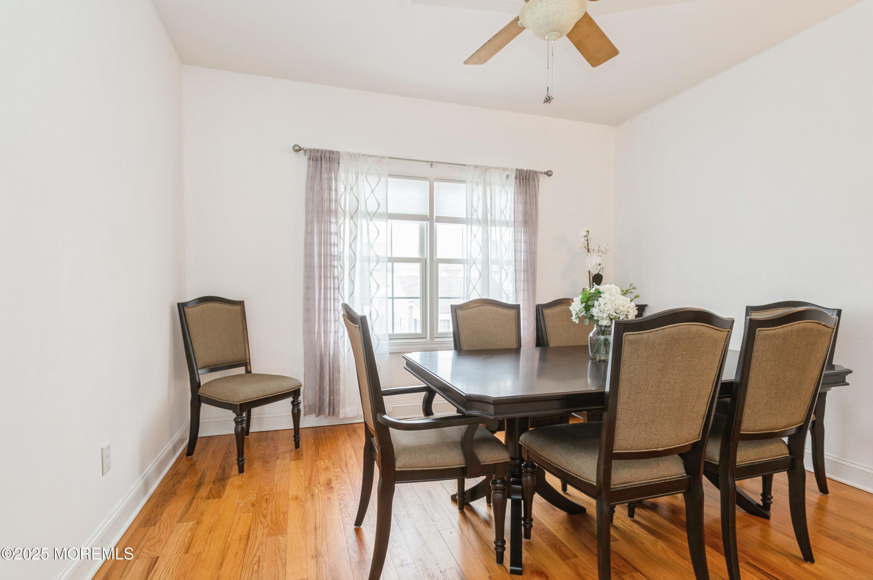 143 North Bayside Road Lavallette, NJ 08735 - Photo 7 of 23 a view of a dining room with furniture and a window