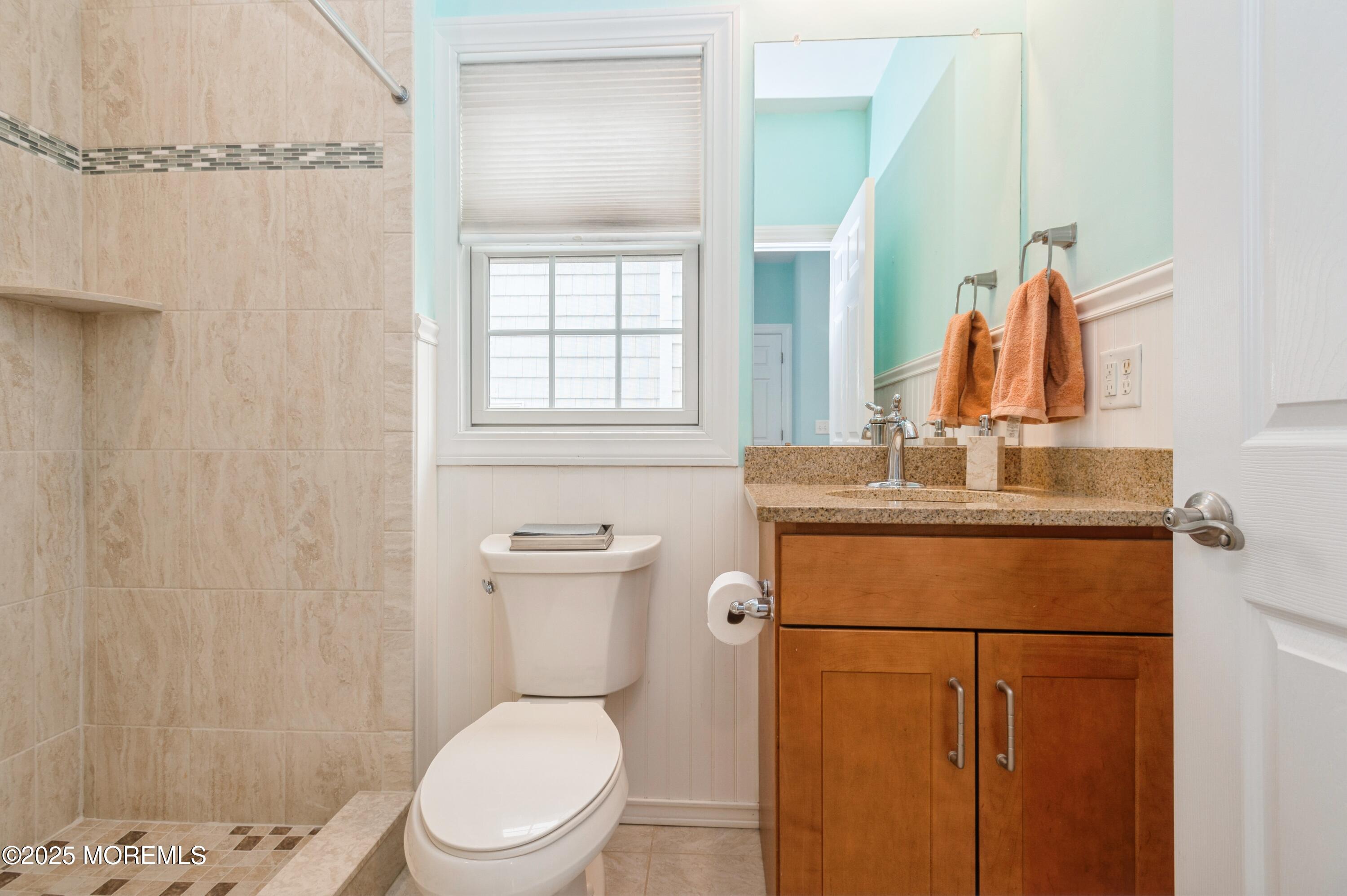 143 North Bayside Road Lavallette, NJ 08735 - Photo 9 of 23 a bathroom with a granite countertop toilet sink and mirror