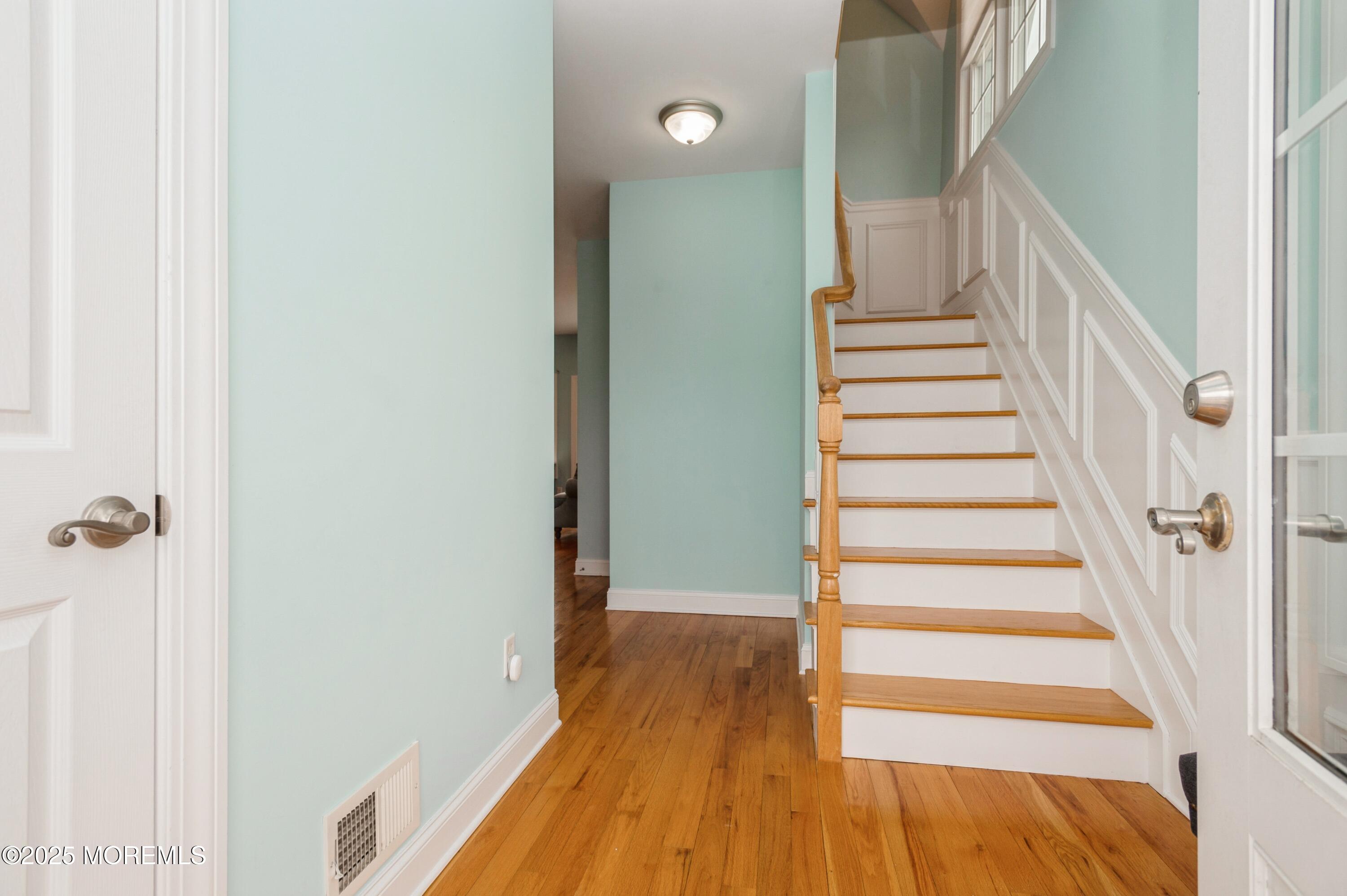 143 North Bayside Road Lavallette, NJ 08735 - Photo 10 of 23 a view of a hallway with wooden floor and entryway