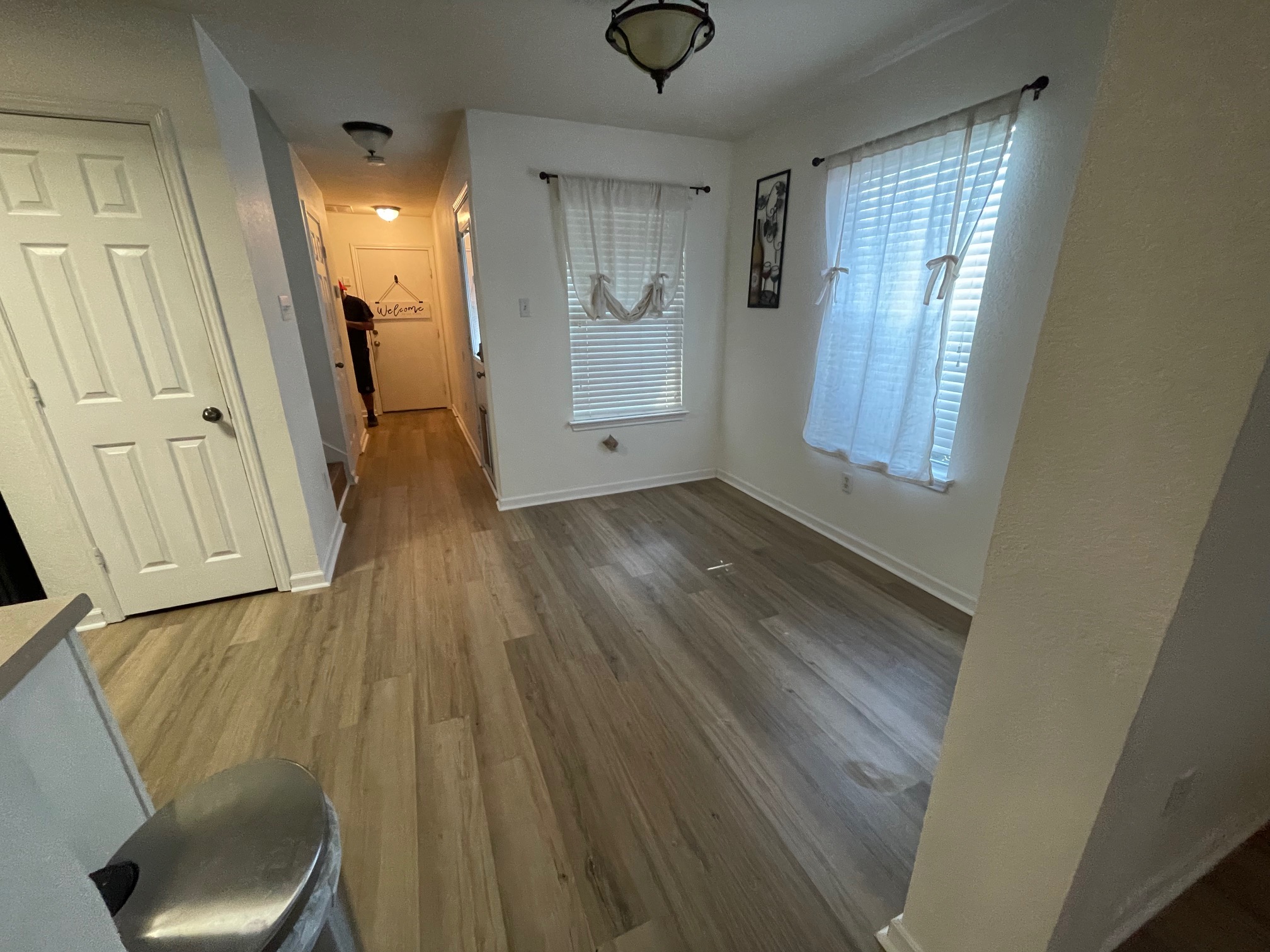 1000 Berry Bend Path Round Rock, TX 78664 - Photo 4 of 20 Natural light filters through the windows, illuminating the freshly installed wood-look flooring in this inviting space.