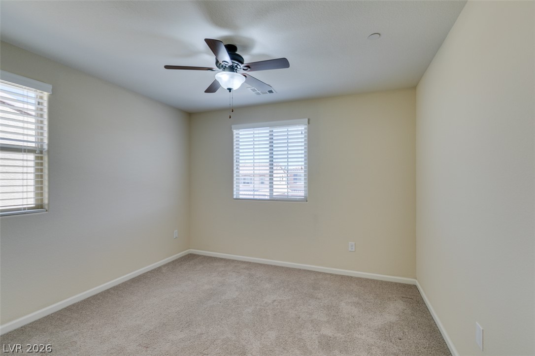 2549 Sable Ridge Street Henderson, NV 89044 - Photo 38 of 48 A well-proportioned bedroom features soft carpeting and generous window light.