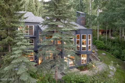 a front view of a house with yard