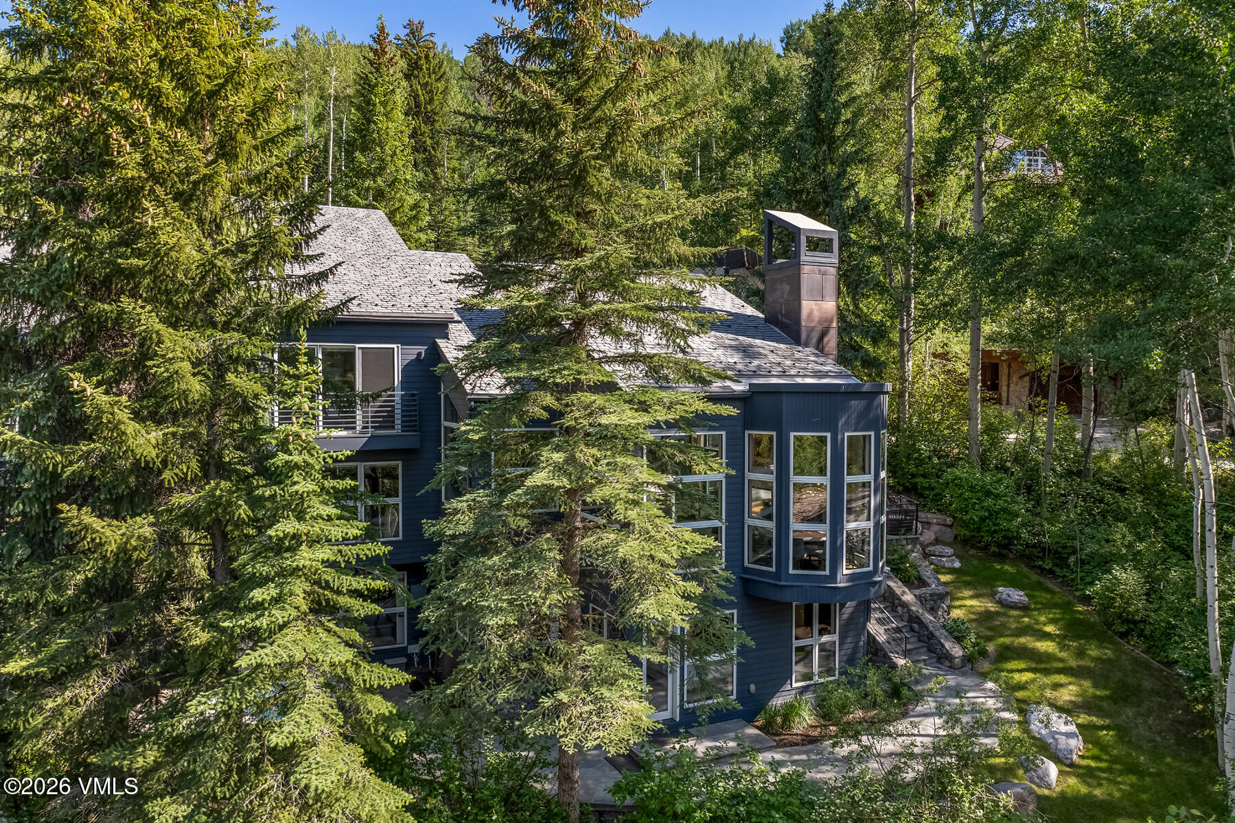 327 Rockledge Road, Unit W Vail, CO 81657 - Photo 2 of 21 a front view of a house with a yard