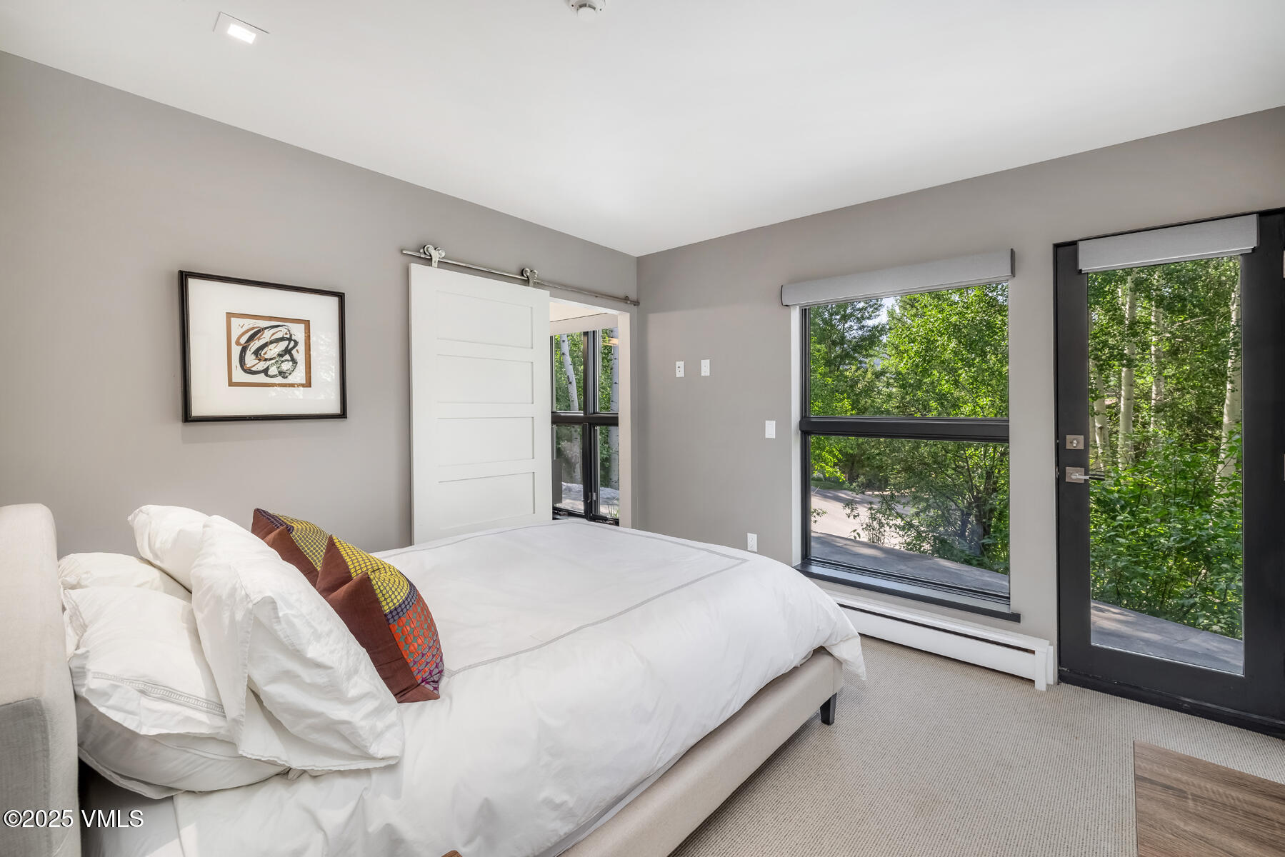 327 Rockledge Road, Unit W Vail, CO 81657 - Photo 23 of 31 a bedroom with a bed and a large window