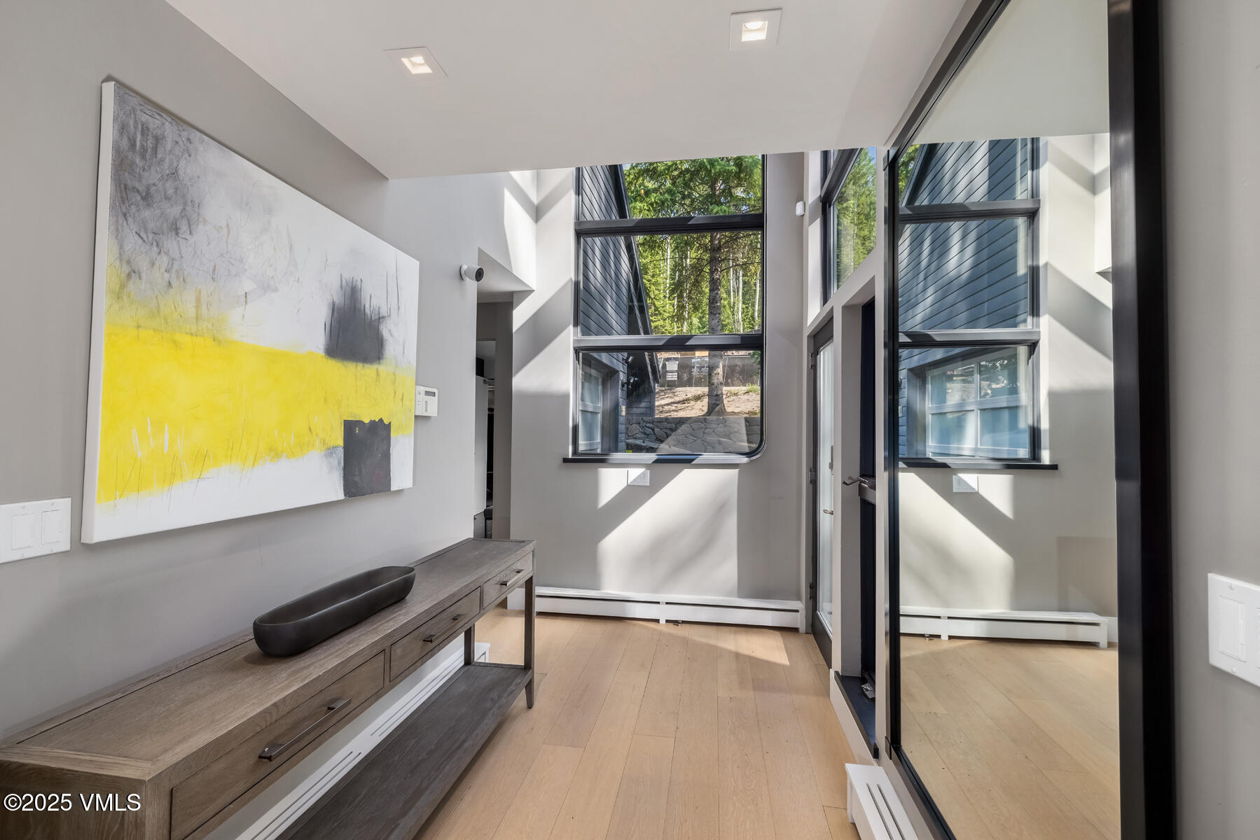 327 Rockledge Road, Unit W Vail, CO 81657 - Photo 25 of 31 a hallway with a large window and a flat screen tv