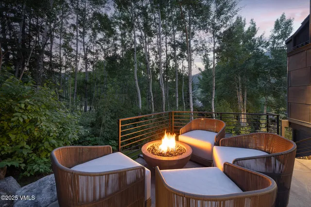 a outdoor sitting area with furniture and garden