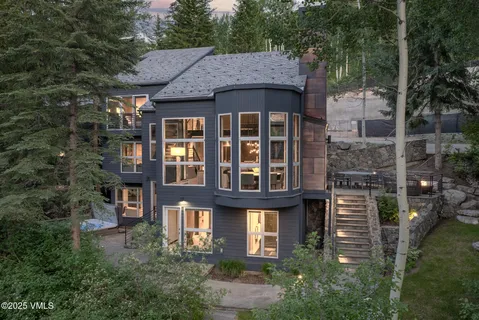 a front view of a residential apartment building with a yard