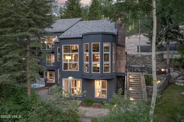 a front view of a residential apartment building with a yard