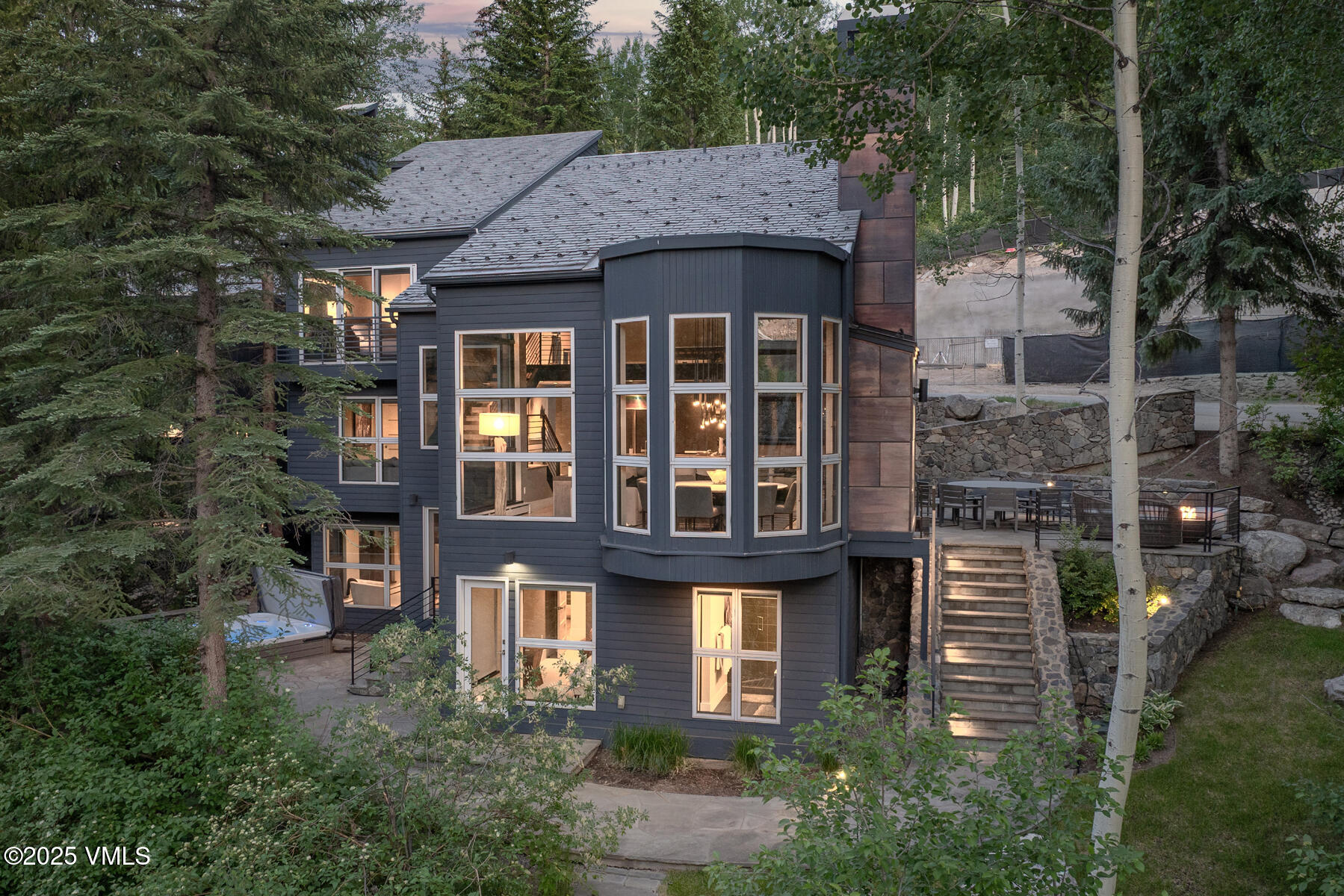 327 Rockledge Road, Unit W Vail, CO 81657 - Photo 30 of 31 a front view of a residential apartment building with a yard