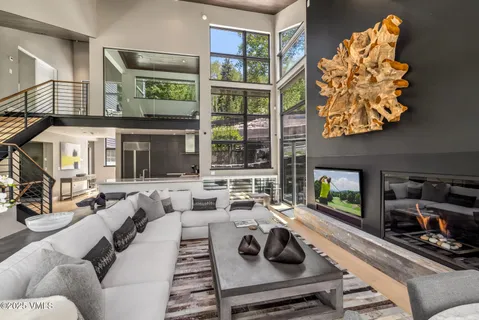 a living room with furniture fireplace and flat screen tv