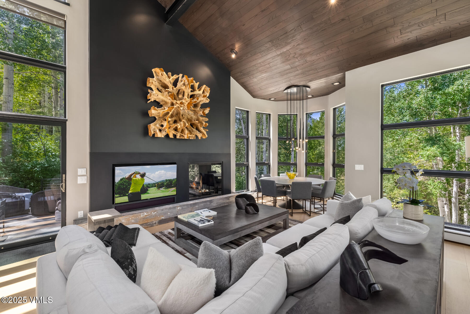 327 Rockledge Road, Unit W Vail, CO 81657 - Photo 6 of 31 a living room with fireplace furniture and a large window