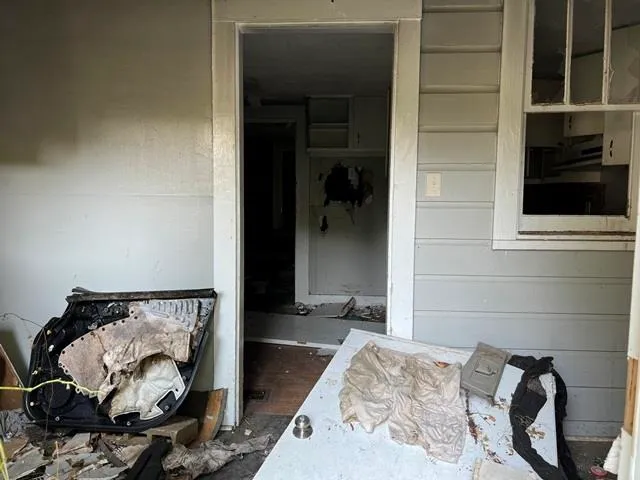 a kitchen with a sink and a stove top oven