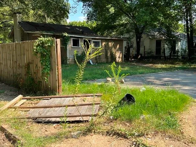 a view of backyard with green space