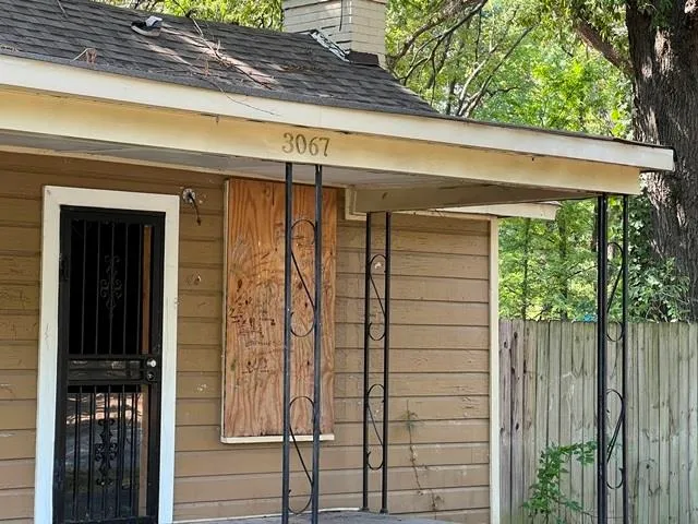 a view of a door and a window