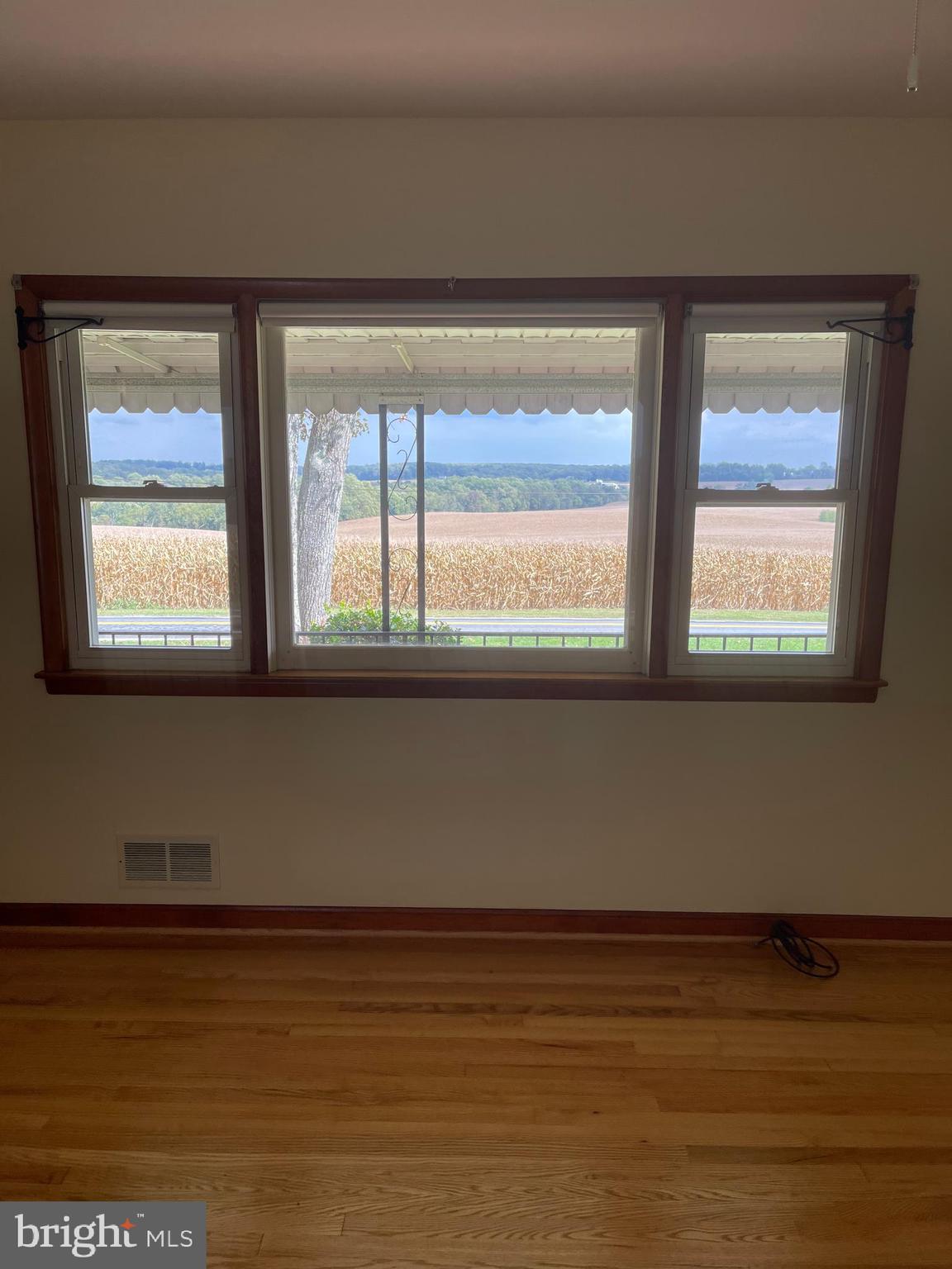 1670 Florence Road Mount Airy, MD 21771 - Photo 10 of 20 a view of a room with wooden floor and a window