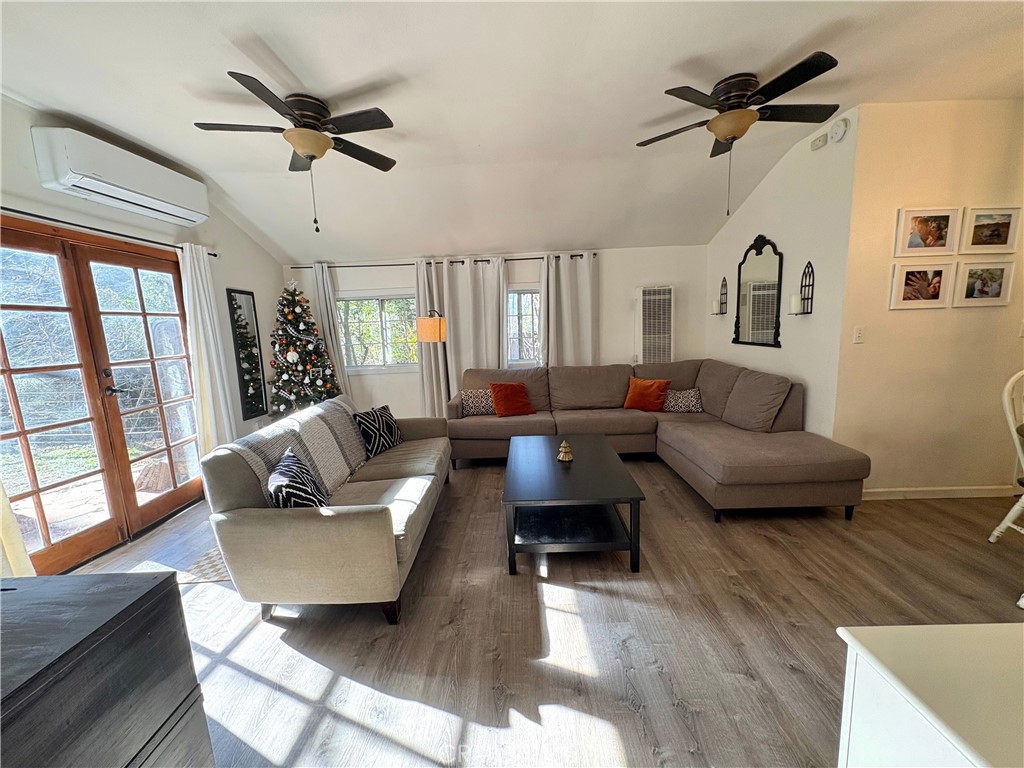 36750 Hilltop Road Yucaipa, CA 92399 - Photo 14 of 27 a living room with furniture and a wooden floor