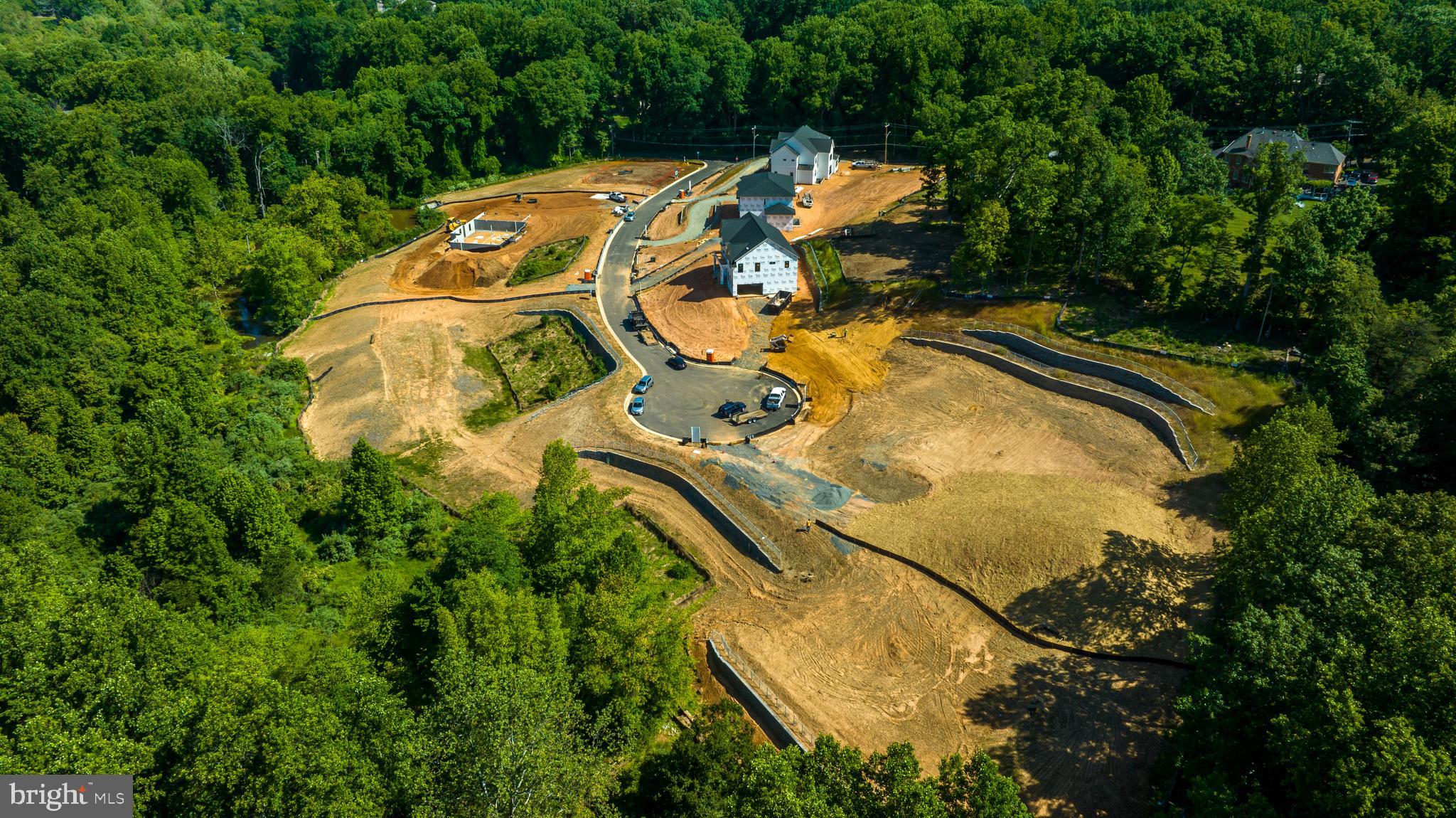 3557 Orchid Pond Way Oakton, VA 22124 - Photo 13 of 38 an aerial view of a house with swimming pool and large trees