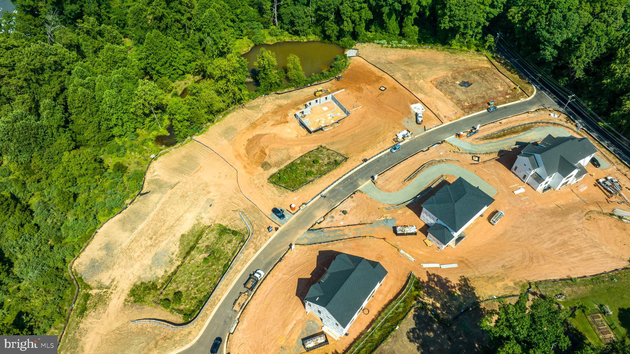 3557 Orchid Pond Way Oakton, VA 22124 - Photo 29 of 38 an aerial view of a house with a yard and signage